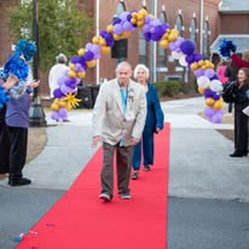 An individual enjoying his moment on the red carpet.
