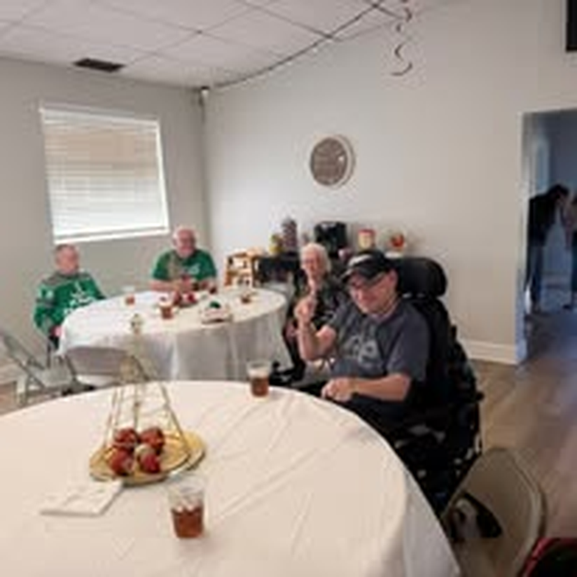 A small group enjoying good company at the holiday party.