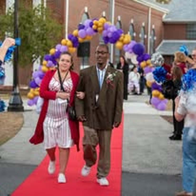 A couple making their entrance at the community gala.