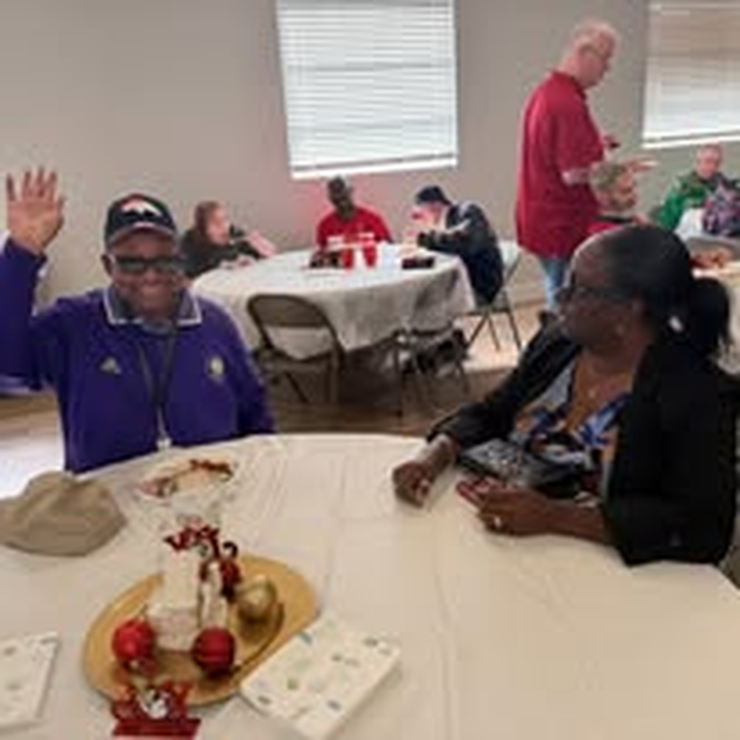 An individual all smiles at the holiday gathering.