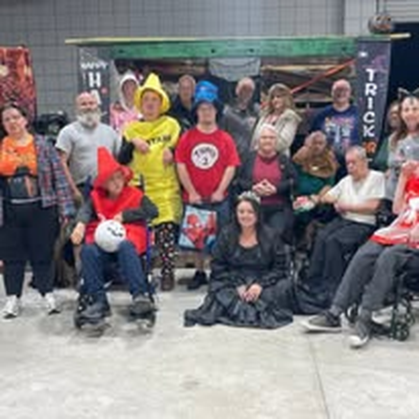 A large group in costume for the Halloween Bash.
