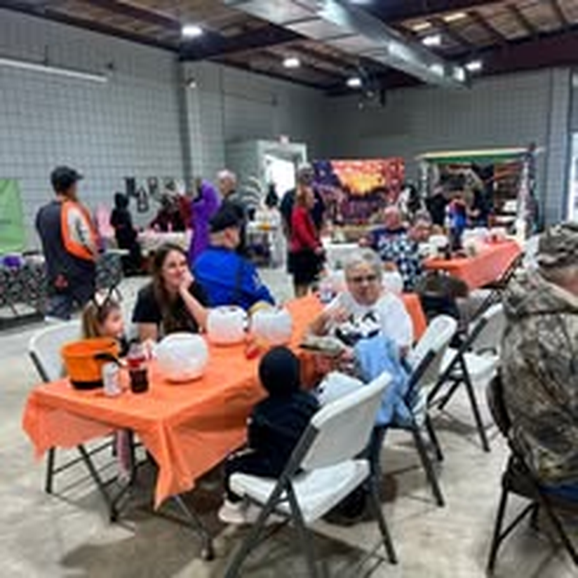 Guests enjoying good company at the community dinner.